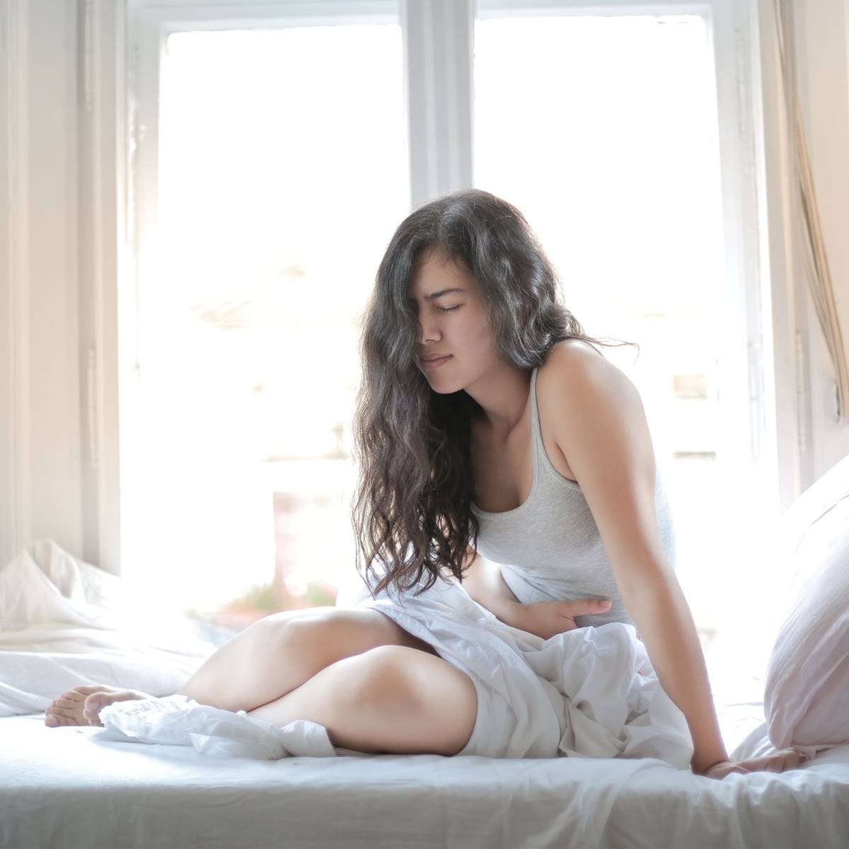 mujer dolor tripa