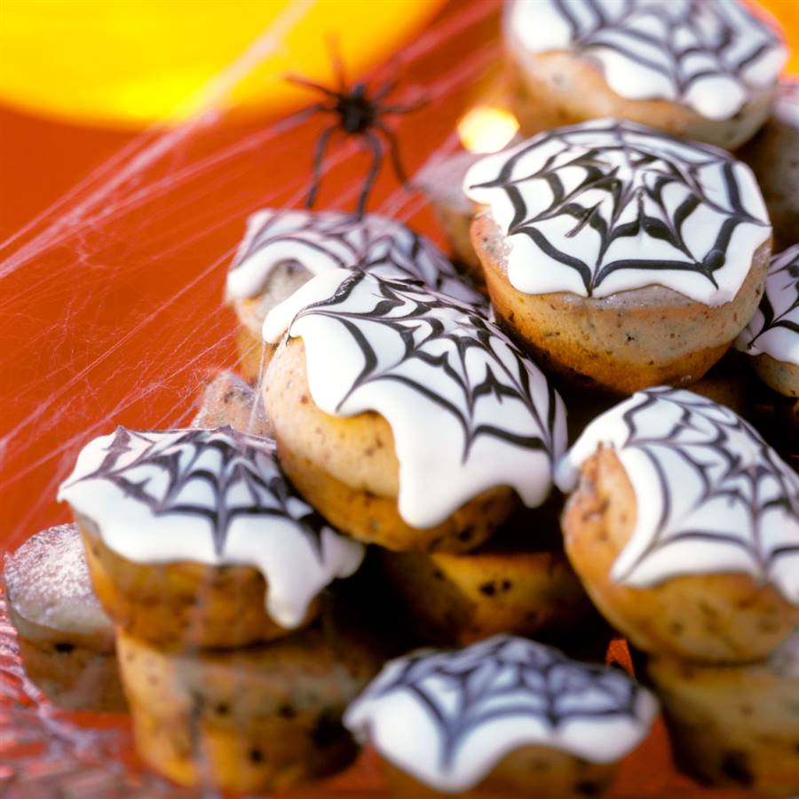 Magdalenas de calabaza con arañas para Halloween